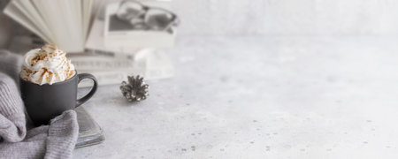 Mug of hot chocolate with milk cream and cinnamon. Winter relax beverage for hygge mood. Large background for banner.の写真素材