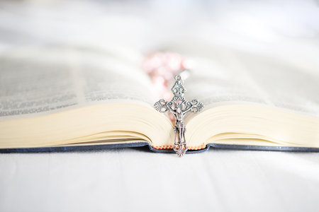 Open Holy Bible in the light with the Cross. Faith, spirituality and Christianity religion concept.の写真素材