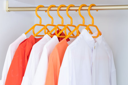 Different clothes on the rank in fashion store. Concept for choice of fashion clothes.の写真素材