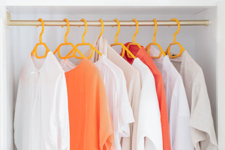 Different clothes on the rank in fashion store. Concept for choice of fashion clothes.の写真素材