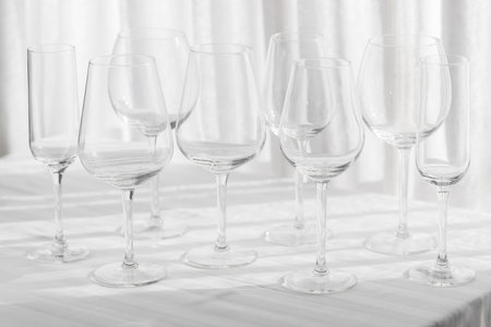 Several glasses for different kinds of wine, red, white and bordeaux on the table. Drinking concept background.の写真素材