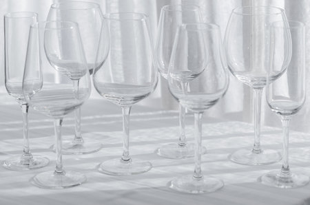 Several glasses for different kinds of wine on the white tablecloth.の写真素材