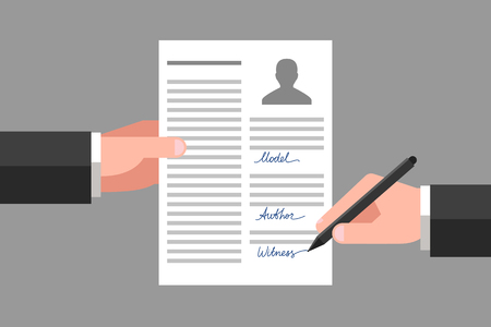 Model release in one hand, another hand is signing this document as witnessのイラスト素材