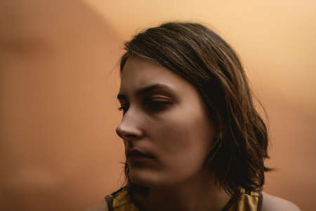 The girl looks away. Dark portraitの写真素材