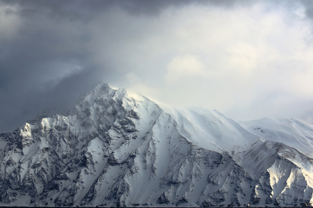 Peaks in the winter sun beam litの写真素材