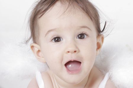 portrait of a cute baby with angel wingsの写真素材