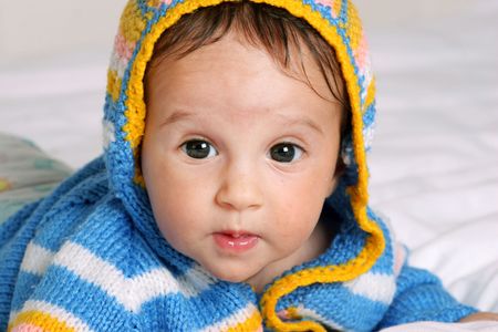 little cute baby girl in blue knitted jumperの写真素材