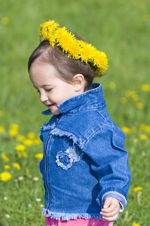 Baby girl with spring wreathの写真素材