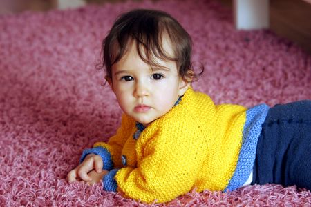 Baby girl learning crawlingの写真素材