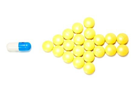 arrow of pills points to the capsule on the white background