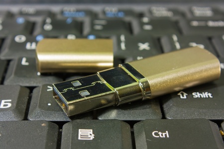 Gold USB disk and on the keyboard