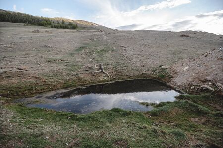 small beautiful mountain lake like mirror at sunsetの写真素材