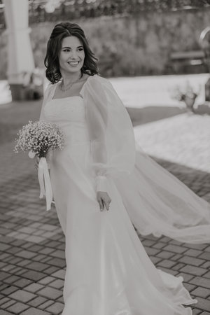 Beautiful bride with a bouquet of flowers. black and white photo.