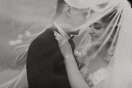 Groom and bride in the forest. Autumn wedding in the forest. Happy wedding, loving couple tender...