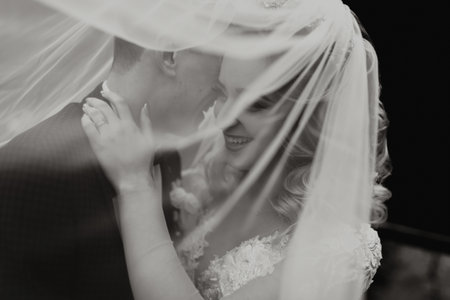 Groom and bride in the forest. Autumn wedding in the forest. Happy wedding, loving couple tender...