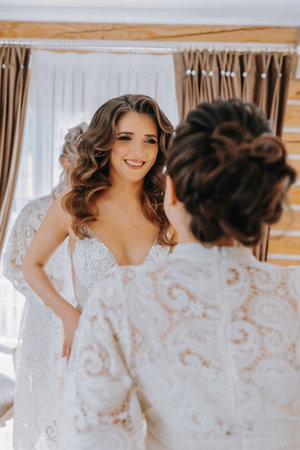 girlfriends help the bride prepare for the wedding.の写真素材