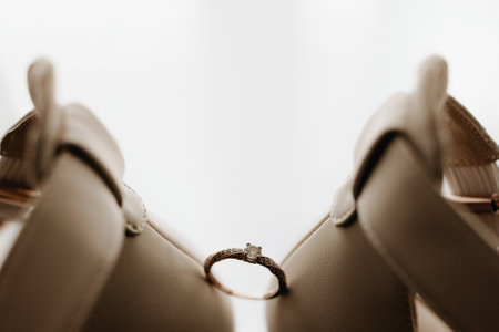 Close up of a gold ring with a diamond. Love, relationship and wedding concept. Soft and selective...