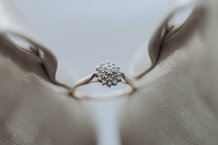 Beige open elegant shoes. The bride's headband sits between a pair of beige sandals. The bandage on the bride's leg is on the shoes, pointedly. Fashion. Style. Wedding photoの写真素材