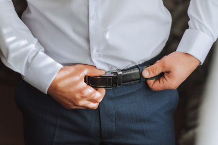 The morning of the groom, the groom prepares for the wedding ceremony, dresses in a suit and shoes....