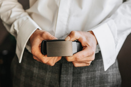 The morning of the groom, the groom prepares for the wedding ceremony, dresses in a suit and shoes....