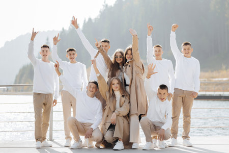 friendship, movement, action, freedom and people concepts - group of happy teenage students or...