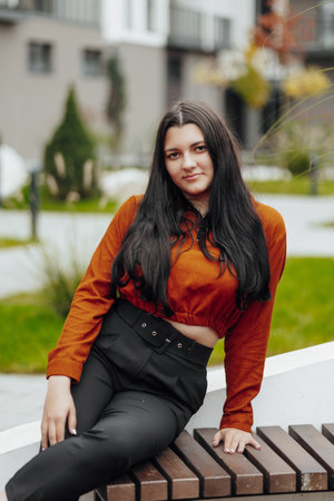 Vertical photo. Beautiful carefree young teenage girl in casual clothes. Portrait of a beautiful...