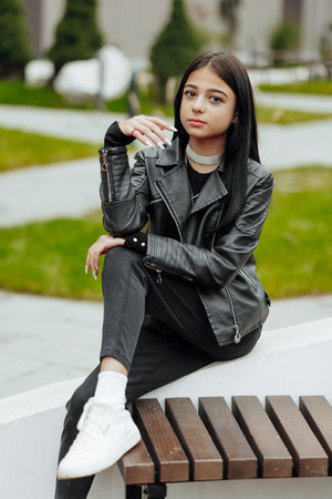 Vertical photo. Beautiful carefree young teenage girl in casual clothes. Portrait of a beautiful...