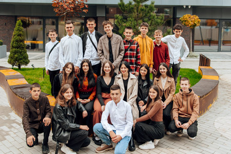 friendship, movement, action, freedom and people concept - group of happy teenagers or school...