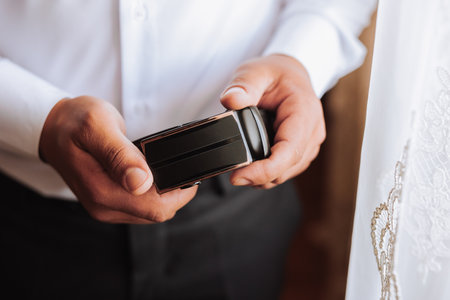 The morning of the groom, the groom prepares for the wedding ceremony, dresses in a suit and shoes....