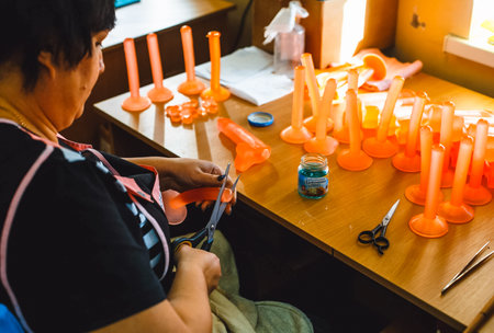 Krasnodar, Russia - April 11, 2017: Rubber products factory for a sex shop. Workers process rubber penises. Reduction to the presentation of products. Sex toys.のeditorial素材