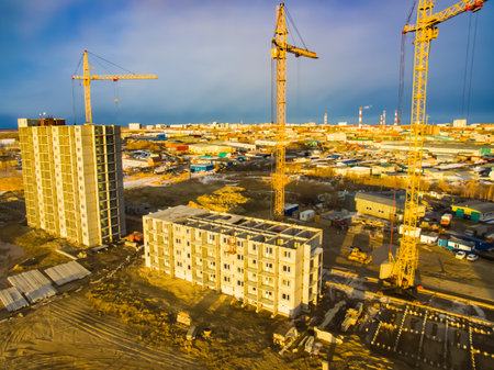 Construction of new residential buildings. Tower cranes at the construction site.の写真素材