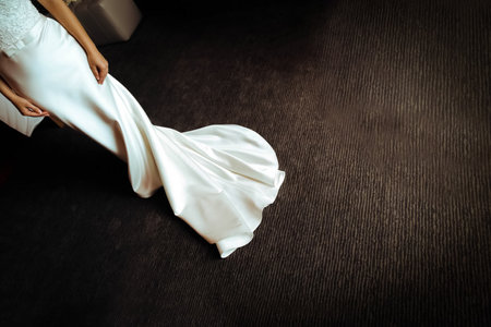 The bride's dress on the dark floor. Wedding.の写真素材