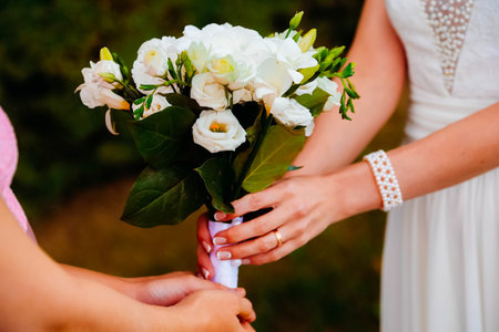 The bride is congratulated and given a bouquet of flowers. Wedding.の写真素材