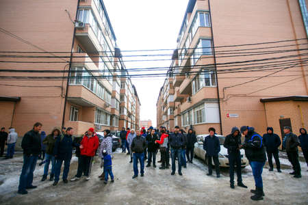 Krasnodar, Russia - April 04, 2019: Residents of apartment buildings went out into the yard. A lot of people in the yard.のeditorial素材