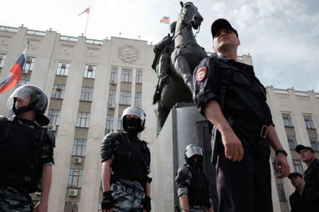 Krasnodar, Russia - August 10, 2019: Police stand in a cordon at an unsanctioned opposition rally. Suppression of rights and freedoms in Russia.のeditorial素材