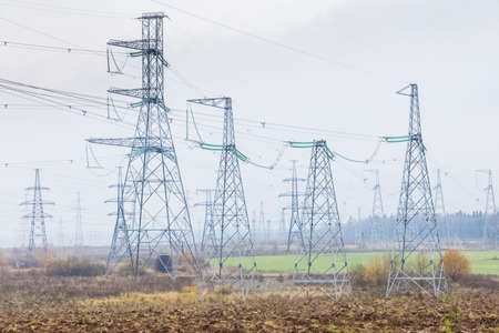 Power line supports. Electricity transmission and posts.