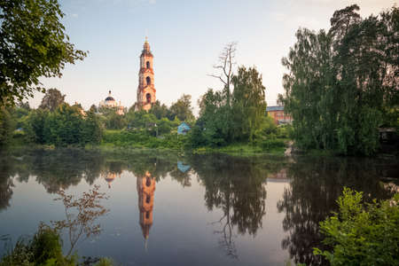 The old church by the lake. Ancient architecture in Russiaの写真素材