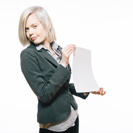 Young pretty student hold a white sheet of paper in handsの写真素材
