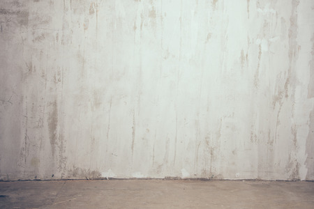 old textured gray wall with the strip of floorの写真素材