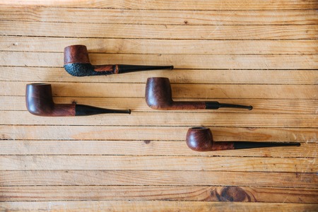 five wooden tobacco pipes. top view. still lifeの写真素材