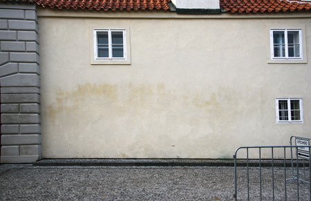 Wall of old house in Europe on the cobble stones streetの写真素材