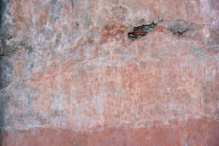Pink multicolored weathered outdoor wall. Urban textured background.の写真素材