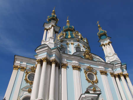 St. Andrew's Church, Kiev. Nice view of the blue and gold domes of the church against the background of the bright blue sky. Baroque temple designed by architect Bartolomeo Rastrelliのeditorial素材