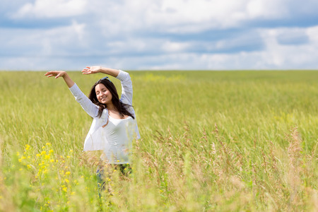 happy girl dancing outsideの写真素材