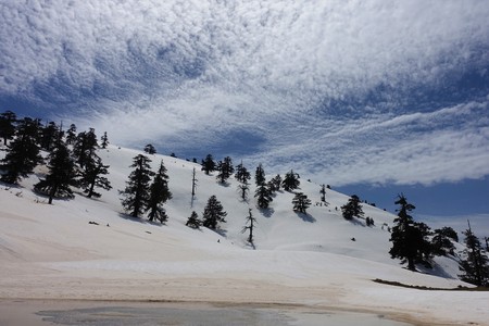 Cloud formations on a blue sky. The picture was taken while hiking to Avgo peak in Vovousa, Epirus, Greece.の写真素材