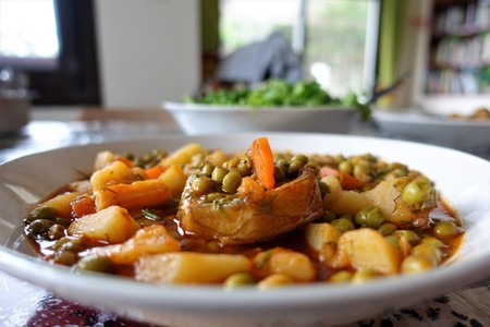 Greek Dilled Peas with Artichoke Hearts A traditional Greek vegan dish with artichoke hearts, peas,...