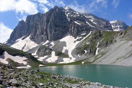 Astraka peak Astraka peak raises behind alpine glacier lake Kseroloutsa in Tymfi, Greece. This picture is rare as Kseroloutsa has usually much less water and dries out completely in summer months.の写真素材