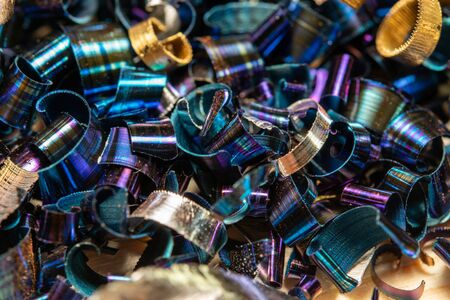 Metal shavings close-up multicolored. the waste after processing of metal drill to the lathe.の写真素材