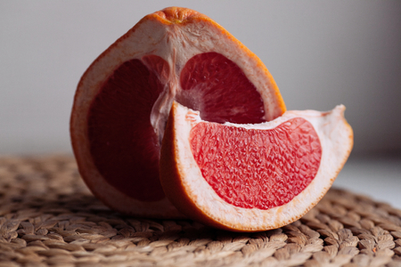 Fresh red grapefruit on the table.の写真素材