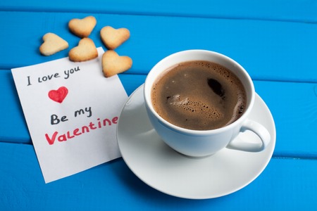 Cup of coffee with cookies for Valentines Day.の写真素材